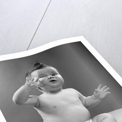 1950s full figure baby sitting gesture hand touching cheek face expression funny by Anonymous