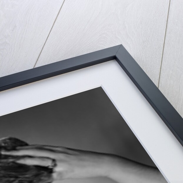 1950s smiling woman washing shampooing hair in sink looking at camera by Anonymous