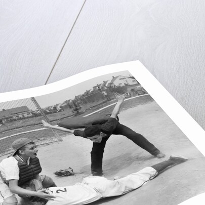 1950s little league umpire calling safe player sliding into home plate by Anonymous