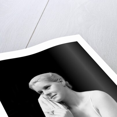 1930s blond woman washing face with washcloth towel by Anonymous