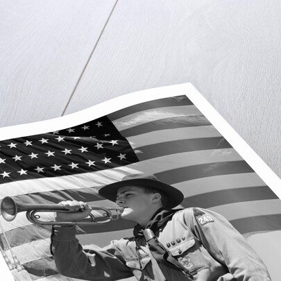 1940s boy scout playing bugle in front of 48 star american flag by Anonymous