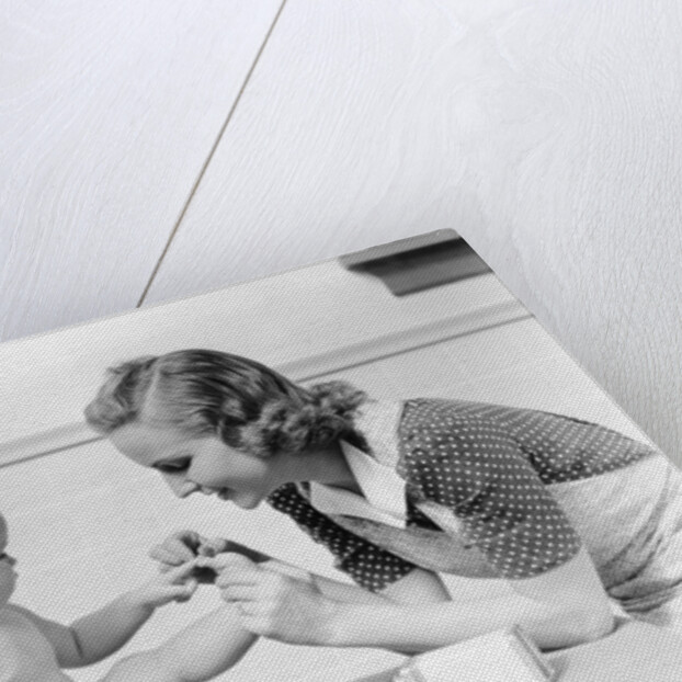 1930s mother touching baby toes fingers this little piggy nursery rhyme by Anonymous