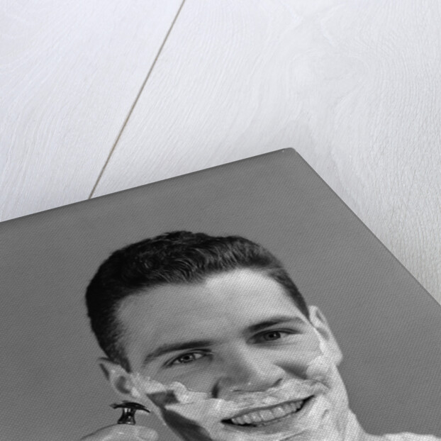 1940s smiling man shaving wearing tee shirt by Anonymous
