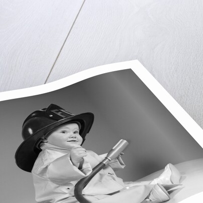 1960s baby fireman with safety hat coat and fire extinguisher by Anonymous