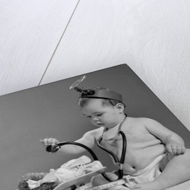 1960s two babies playing doctor and nurse with doll studio by Anonymous