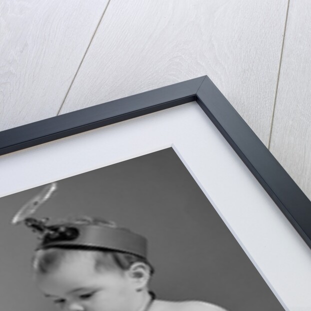 1960s two babies playing doctor and nurse with doll studio by Anonymous