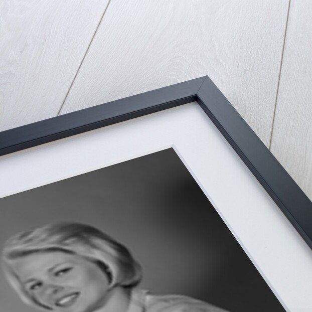 1960s smiling mother and father with twin babies on diaper changing table looking at camera by Anonymous