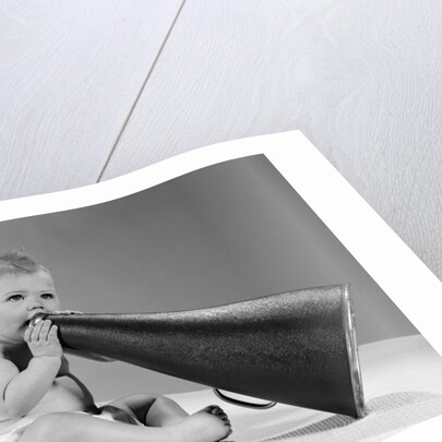 1960s baby in diaper seated holding megaphone by Anonymous