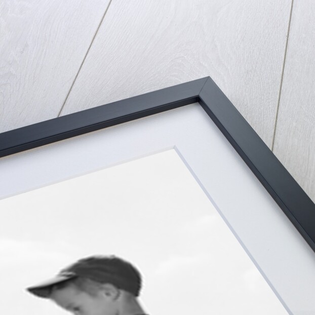 1960s two boys in baseball uniforms choosing sides by getting the upper hand on a bat by Anonymous