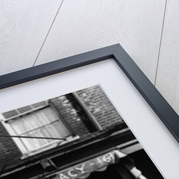 1930s pharmacy storefront by Anonymous