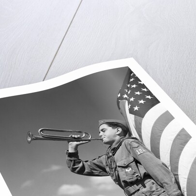 1950s profile of boy scout in uniform standing in front of 48 star american flag blowing bugle by Anonymous