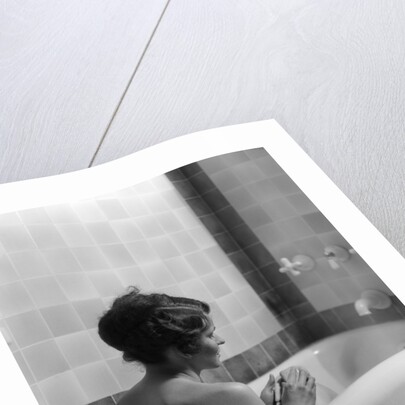 1920s 1930s woman sitting in bath tub by Anonymous