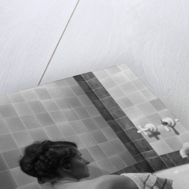 1920s 1930s young brunette woman sitting in luxury bathtub taking a bath by Anonymous