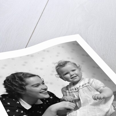 1930s smiling mother and happy child looking at camera by Anonymous