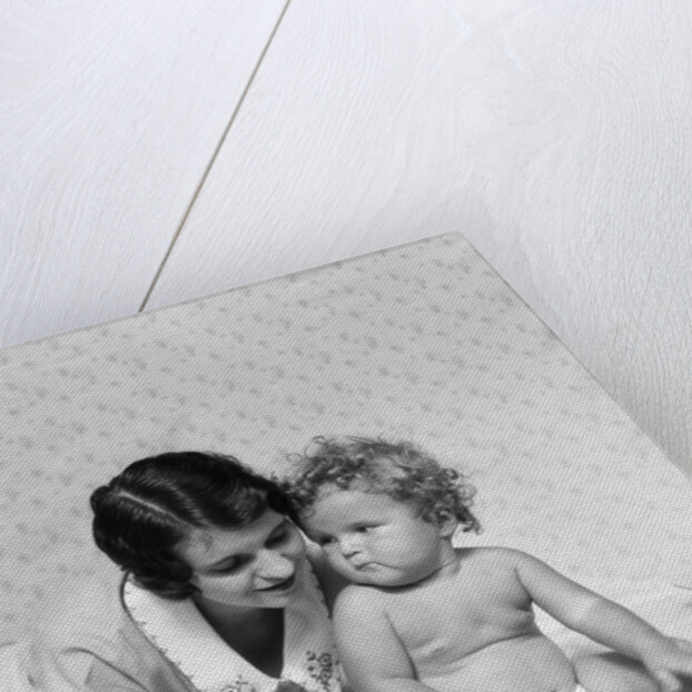 1920s 1930s woman mother lying sitting with baby on blanket by Anonymous