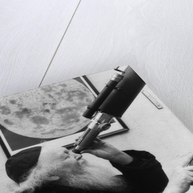 1930s old astronomer white hair and beard wearing skull cap looking through telescope by Anonymous