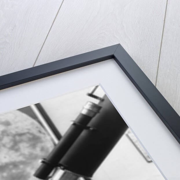 1930s old astronomer white hair and beard wearing skull cap looking through telescope by Anonymous