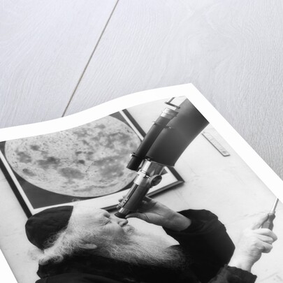 1930s old astronomer white hair and beard wearing skull cap looking through telescope by Anonymous