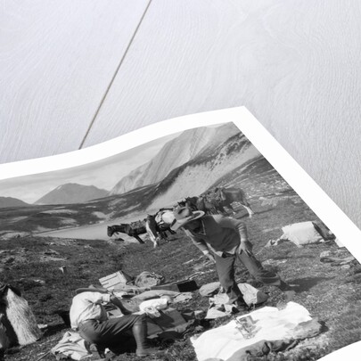 1920s 1930s three men cowboys at campsite preparing food horses in background alberta canada by Anonymous