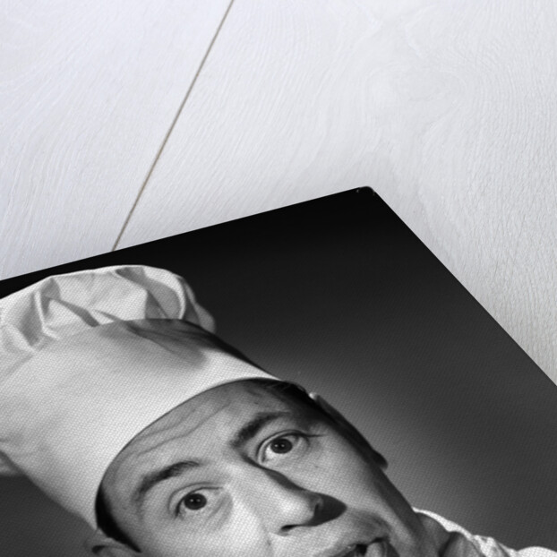 1950s portrait man chef humorous expression looking at camera by Anonymous