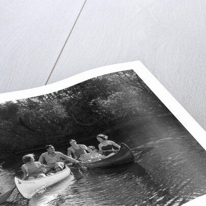 1930s summertime group of five young men & women in two canoes paddling down a stream by Anonymous