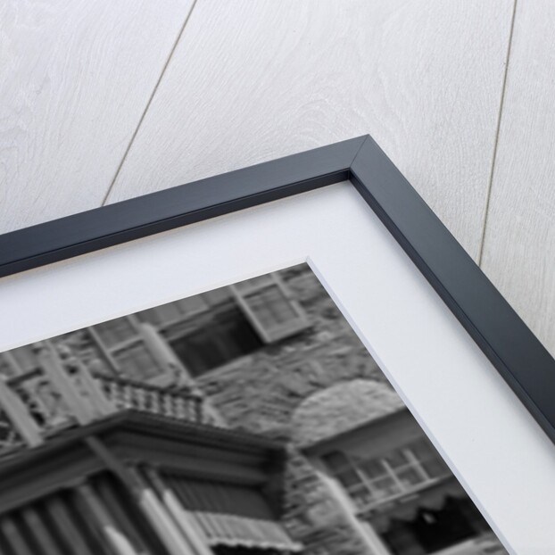 1930s couple walking out of house down sidewalk carrying picnic baskets & thermos jug by Anonymous
