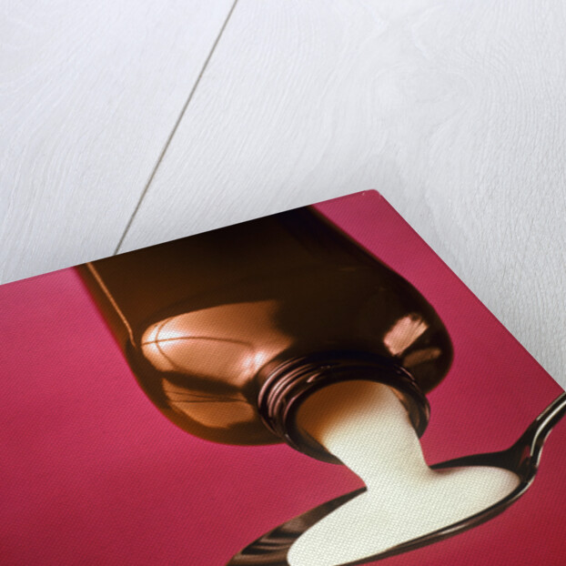 1980s spoonful of white medicine from bottle by Anonymous