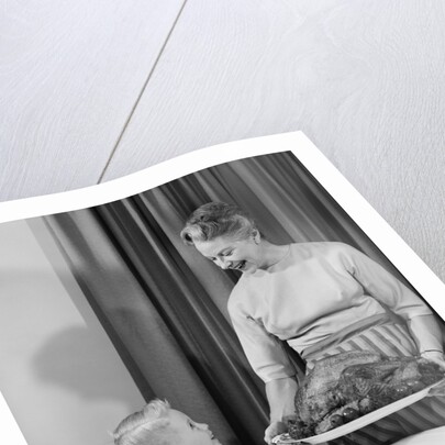 1960s grandmother grandson roast turkey thanksgiving dinner by Anonymous