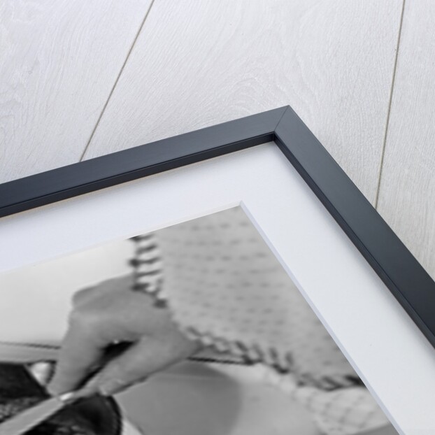 1940s 1950s woman hands frying eggs in iron skillet on electric stove salt and pepper shakers by Anonymous