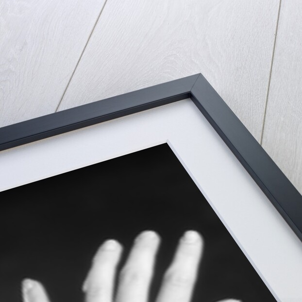 1930s woman's hands tied together by rope overhead view by Anonymous