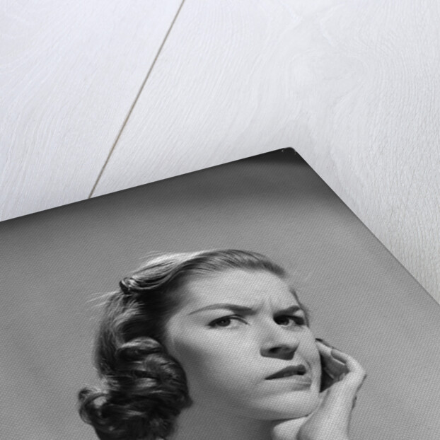 1950s 1960s woman portrait worried facial expression hand to cheek tooth pain by Anonymous