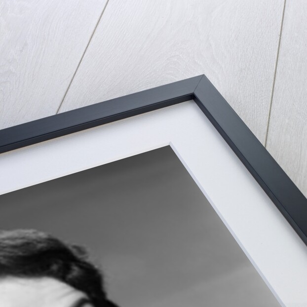 1950s woman smiling wearing pearl necklace looking at camera making okay gesture with hand by Anonymous