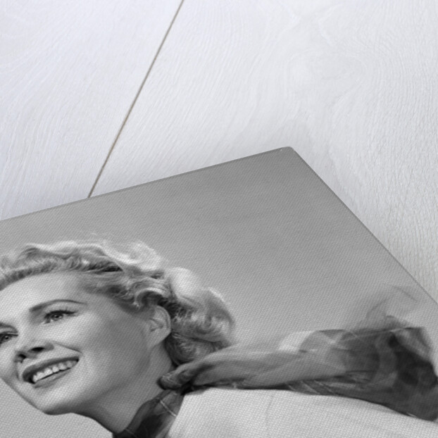 1950s 3/4 profile portrait smiling blond woman with wind blown hair and scarf by Anonymous