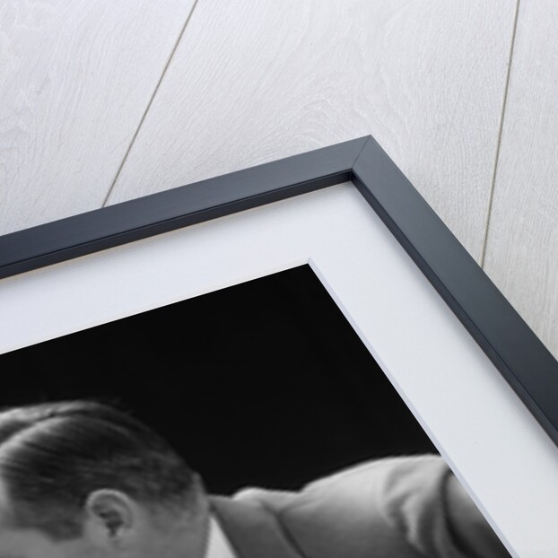 1930s 1940s businessman talking seriously to himself or his twin alter ego by Anonymous