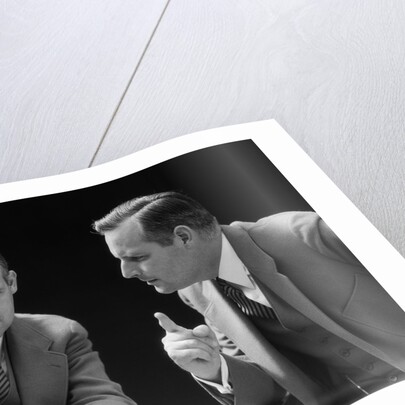 1930s 1940s businessman talking seriously to himself or his twin alter ego by Anonymous