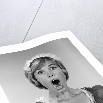 1960s woman in maid uniform eyes and mouth wide open looking at camera by Anonymous