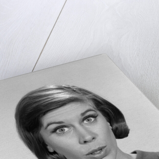 1960s woman portrait looking at camera asking question wonder puzzled funny face expression by Anonymous