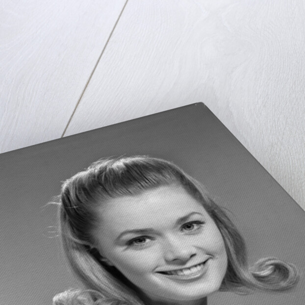 1960s portrait smiling woman wearing print blouse with flip hairdo by Anonymous