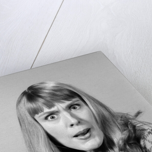 1960s head shot angry woman looking at camera by Anonymous