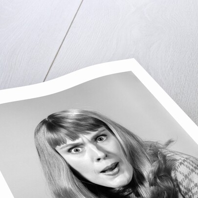 1960s head shot angry woman looking at camera by Anonymous