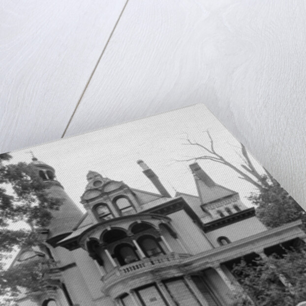 1970s woman in victorian costume standing on front lawn of large abandoned haunted victorian home by Anonymous