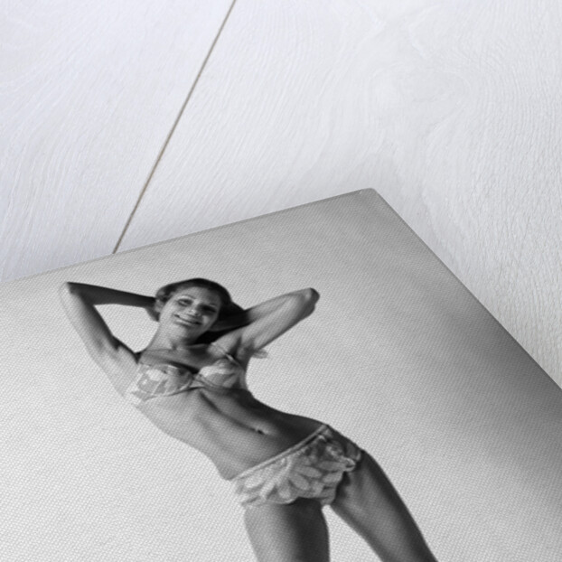 1970s smiling slender young woman standing posing wearing two piece bathing suit looking at camera by Anonymous