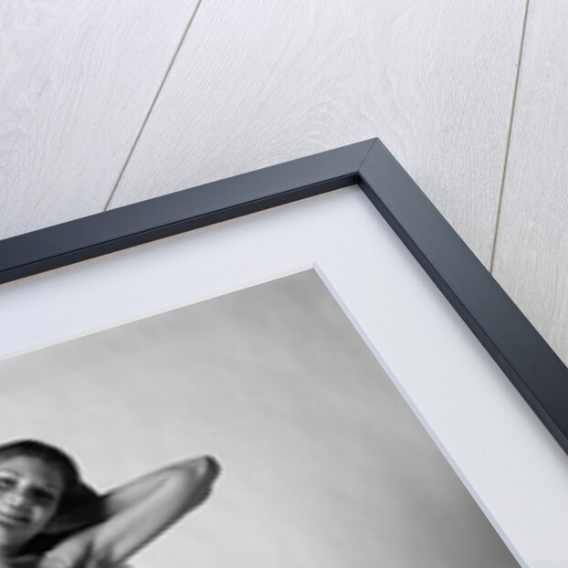 1970s smiling slender young woman standing posing wearing two piece bathing suit looking at camera by Anonymous