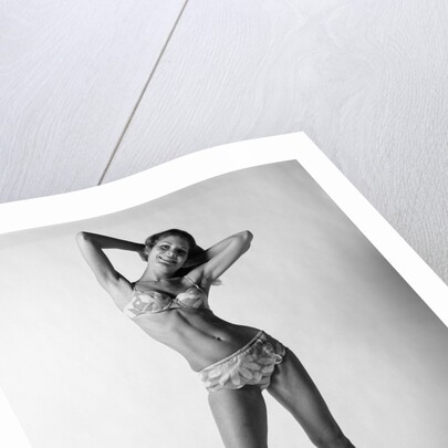 1970s smiling slender young woman standing posing wearing two piece bathing suit looking at camera by Anonymous