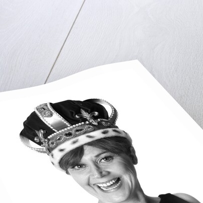 1970s smiling portrait woman wearing queen's crown looking at camera by Anonymous