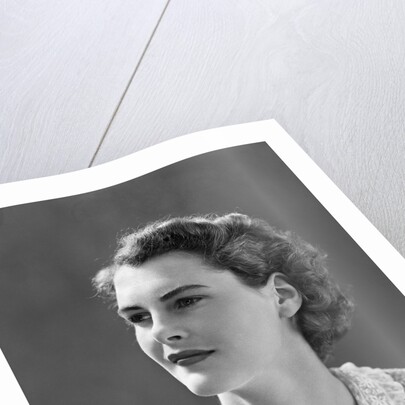 1940s profile portrait brunette woman wearing print dress with lace collar by Anonymous