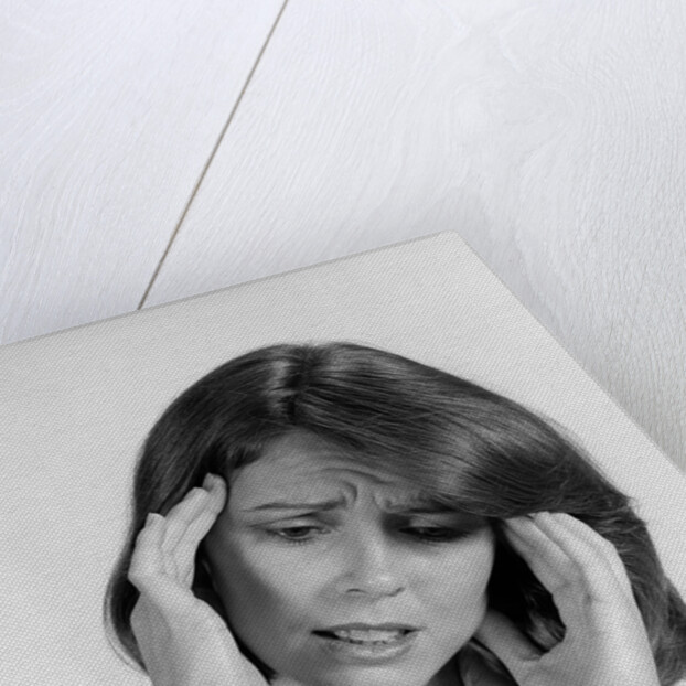 1980s portrait woman hands massaging temple forehead headache distress stress by Anonymous