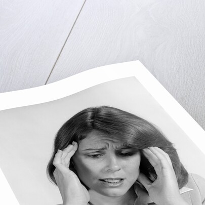 1980s portrait woman hands massaging temple forehead headache distress stress by Anonymous