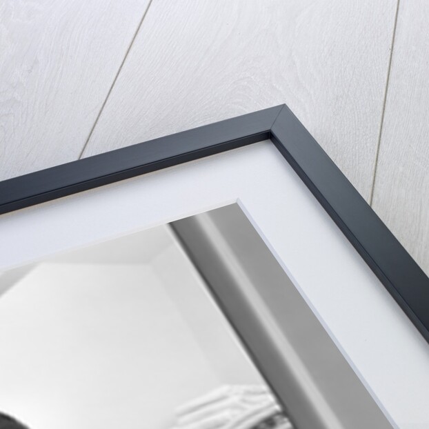 1950s 1960s housewife holding laundry folded towels by linen closet looking at camera by Anonymous