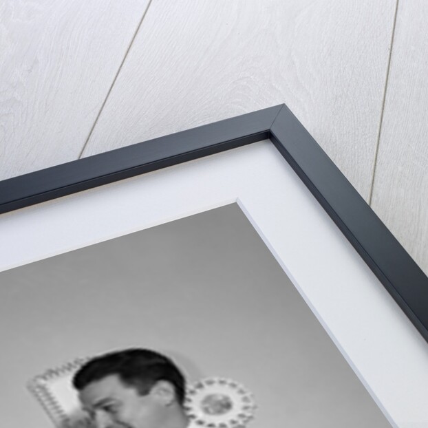 1950s satisfied amused smiling couple husband wife in kitchen cooking together by Anonymous